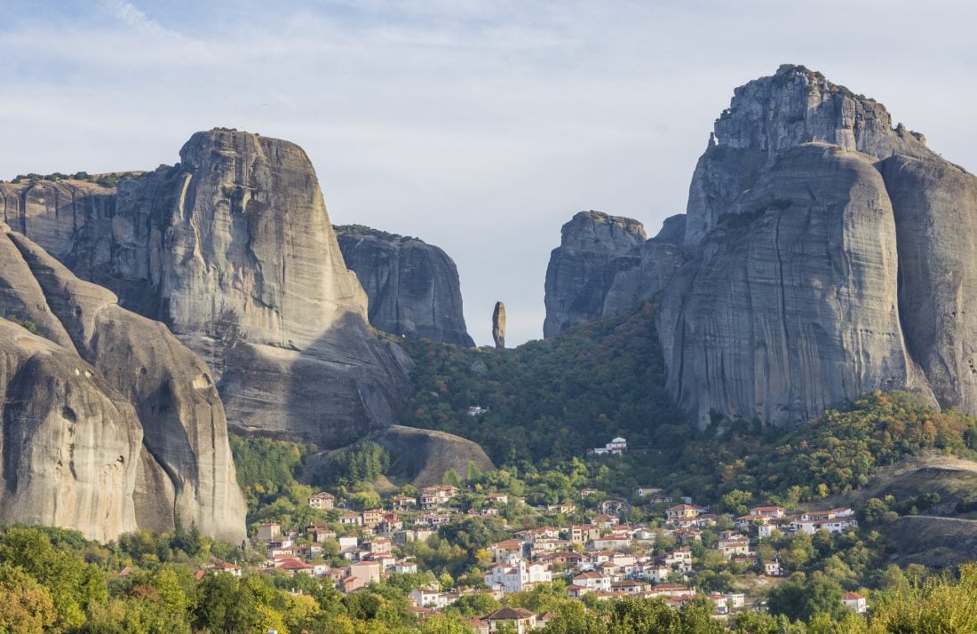 meteora rises up above the village of kastraki