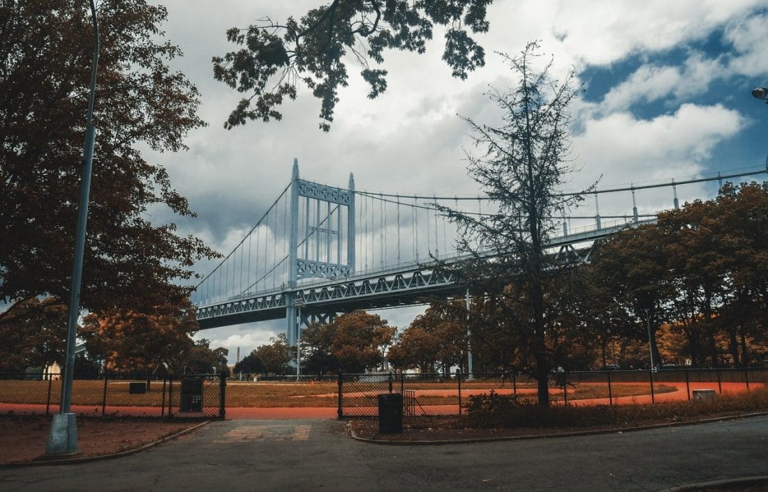 view of the Triborough bridge above Astoria Park in NYC